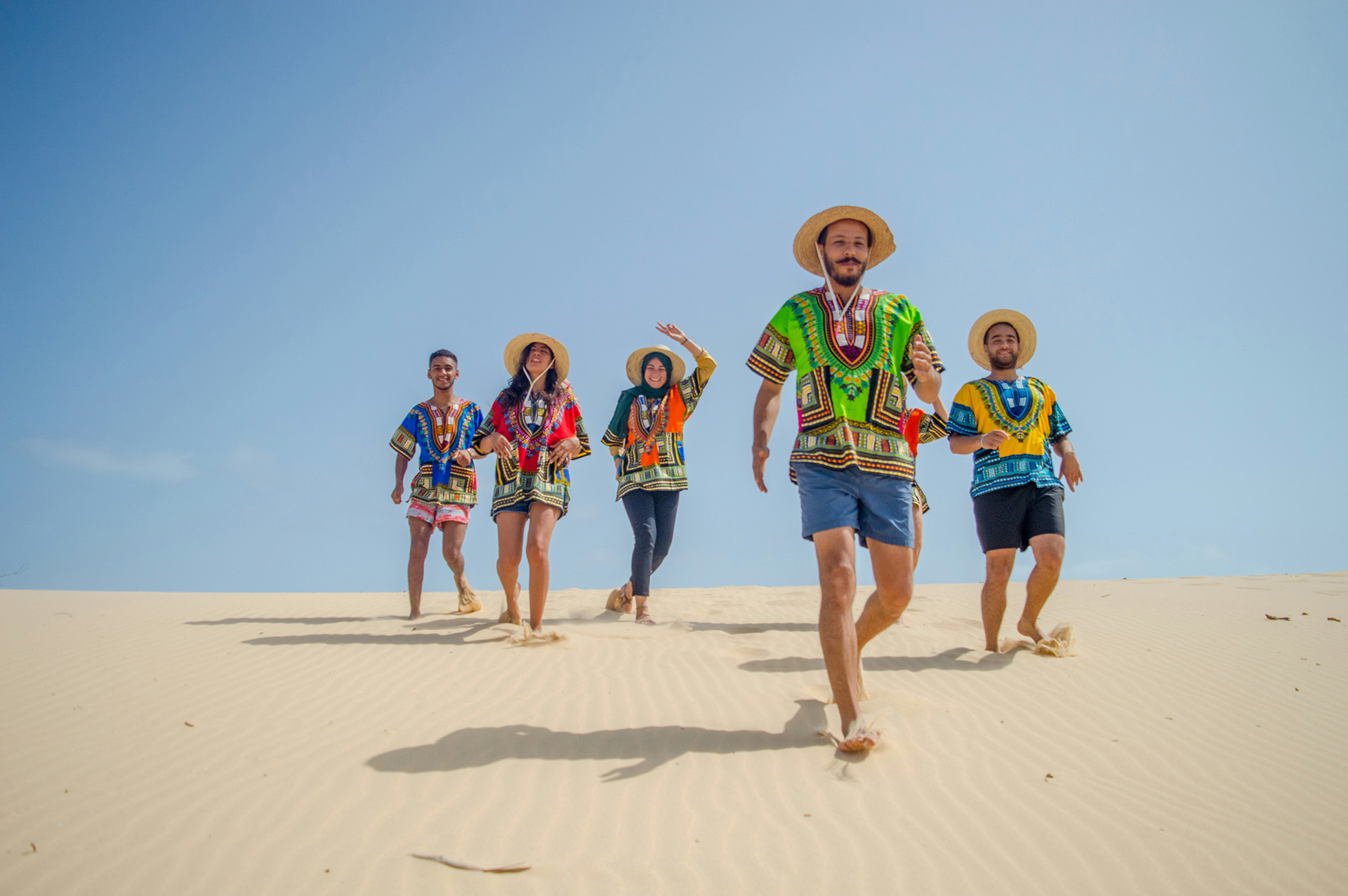 Group of travelers on sand dunes